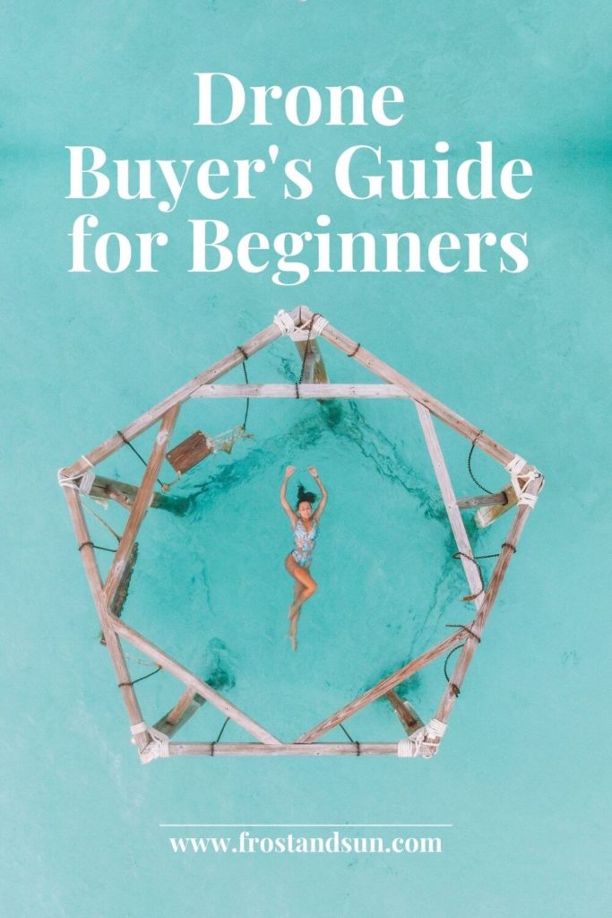 Drone photo of a woman floating in turquoise water in the center of a wooden structure with swings. Text overlay reads "Drone Buyer's Guide for Beginners."