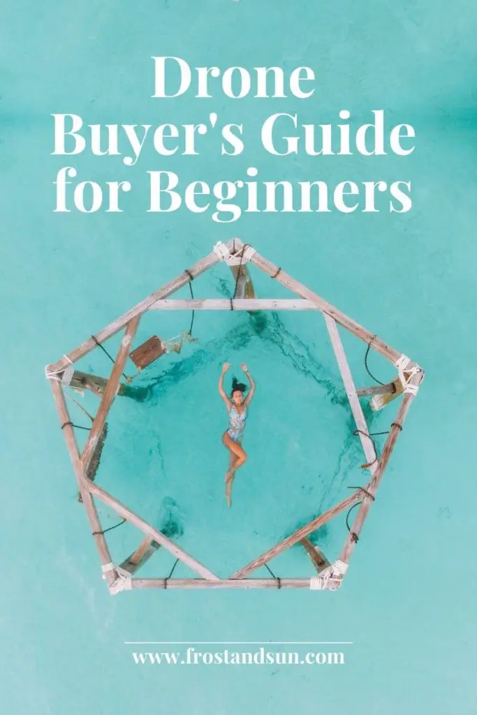 Drone photo of a woman floating in turquoise water in the center of a wooden structure with swings. Text overlay reads "Drone Buyer's Guide for Beginners."