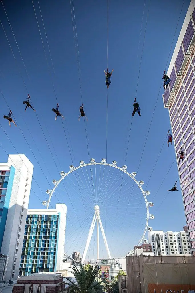 Photo of the LINQ Promenade zipline, pointed toward the High Roller ferris wheel.