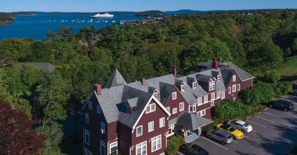 Aerial photo of Cleftstone Manor of Bar Harbor with Frenchman Bay in the background.