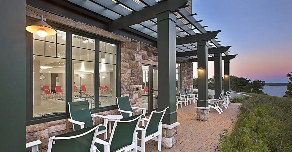 Photo of the exterior of the Hampton Inn Bar Harbor during blue hour.