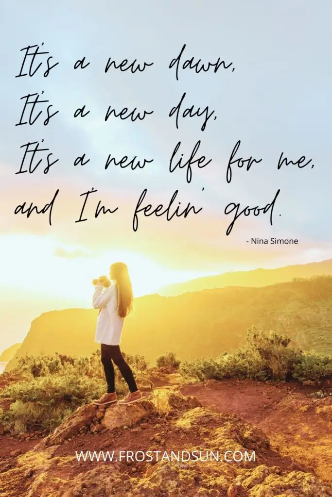 Photo of a woman standing on top of a mountain with binoculars in her hands. Text above reads "It's a new dawn. It's a new day. It's a new life for me. And I'm feelin' good."