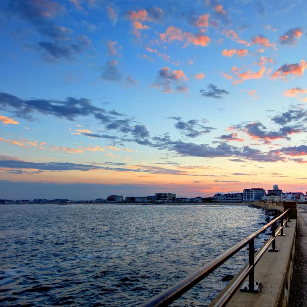 Photo of the walkway along Hampton Beach in New Hampshire at sunrise.