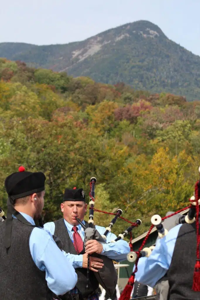 Photo of a group of men playing the bagpipes.