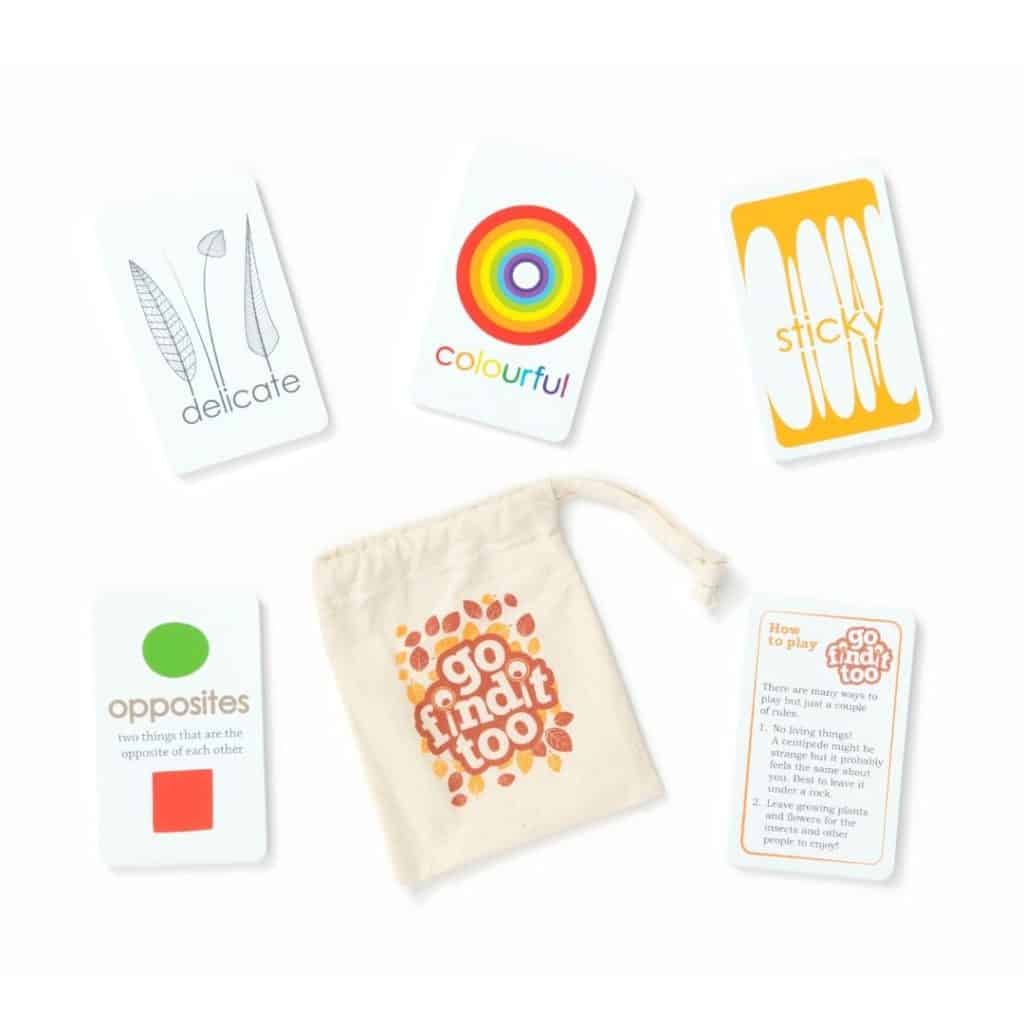 Flatlay with scavenger hunt cards and an orange pouch.