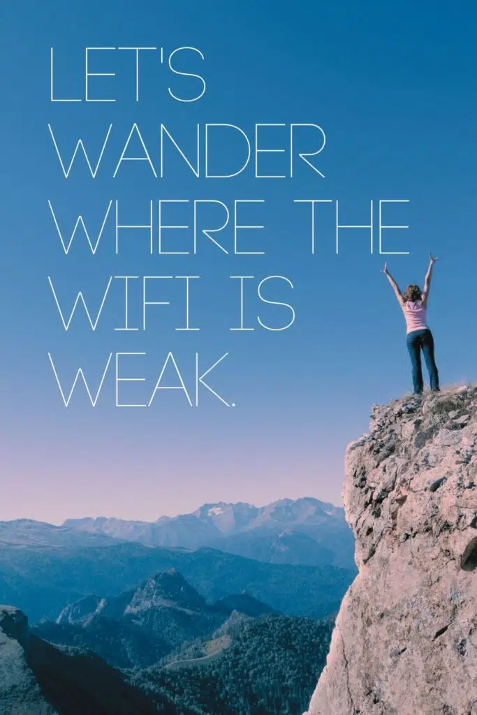 Photo of a woman standing triumphantly on top of a mountain overlooking a valley with more mountains in the background. Text overlay reads "Let's wander where the WiFi is weak."
