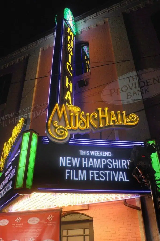 Photo of a music hall marquee lit up at night that says "This Weekend: New Hampshire Film Festival."
