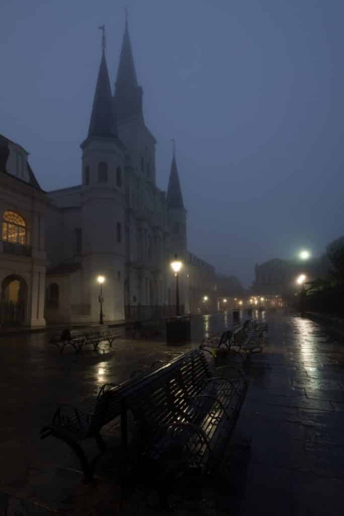 Photo of a misty, foggy Jackson Square in New Orleans at night.
