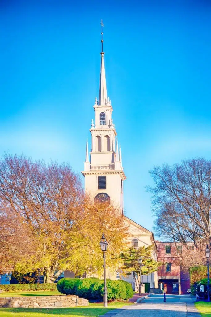 Photo of a church in Newport, Rhode Island with bare trees.