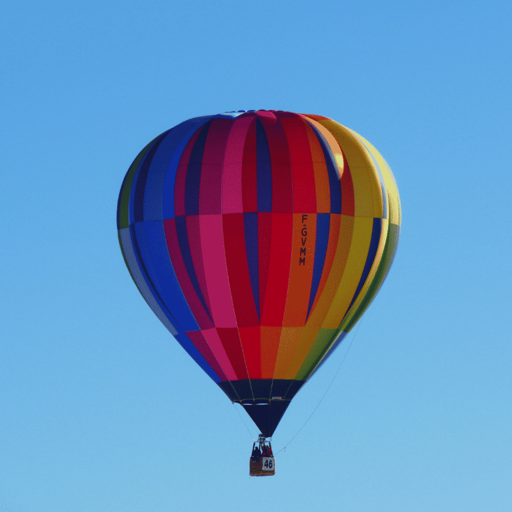 Photo of a colorful hot air balloon in the air.