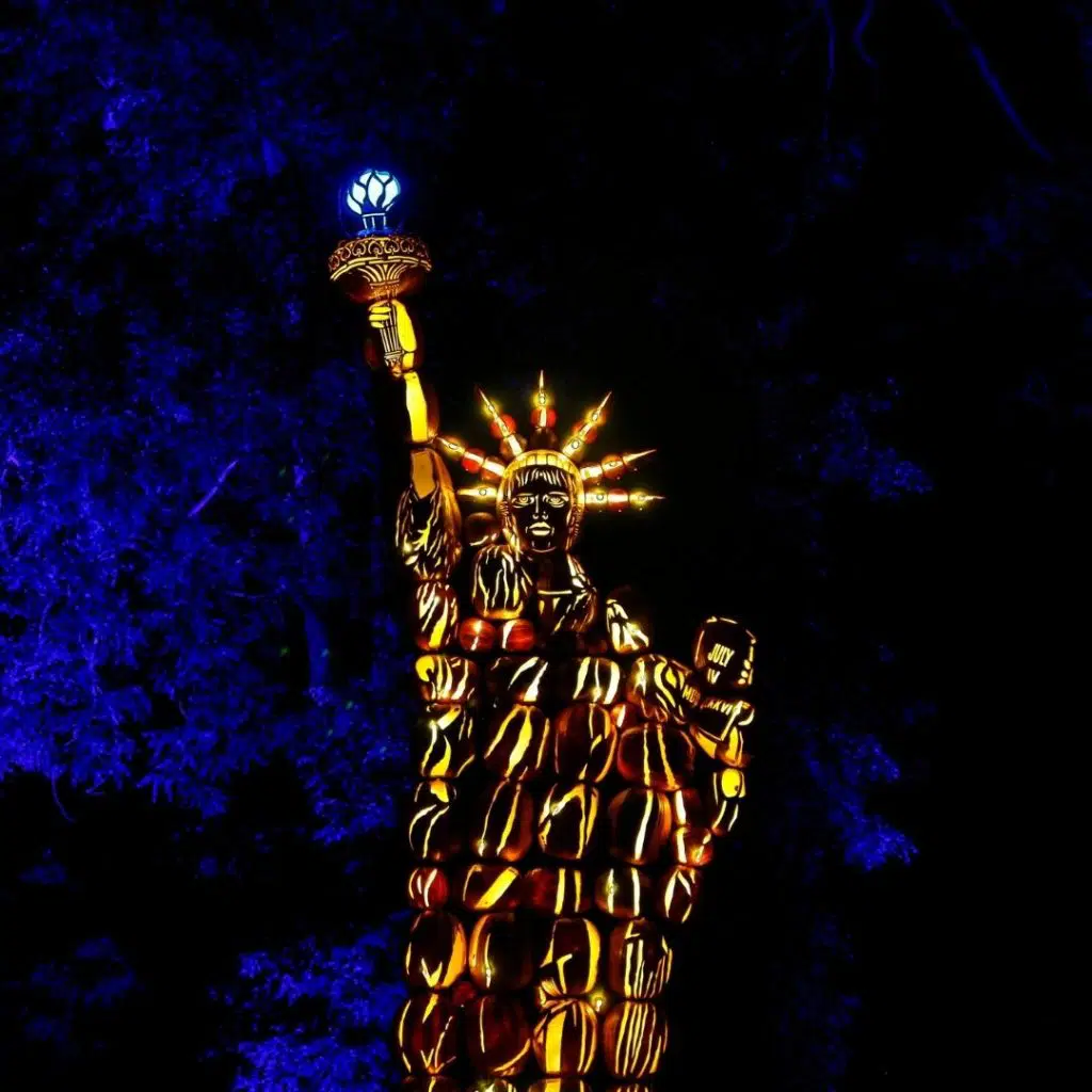 Photo of a replica of the Statue of Liberty made out of carved pumpkins.