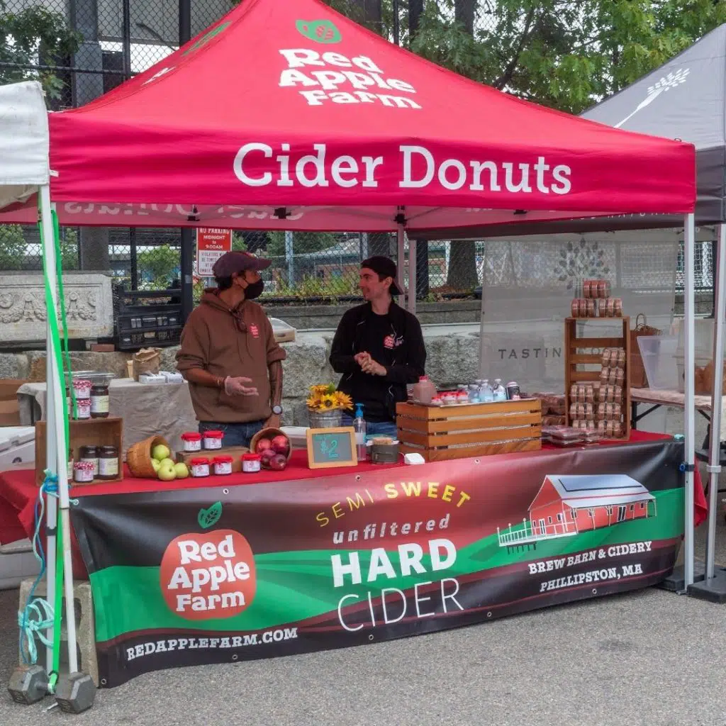 Photo of the Red Apple Farm market tent at SoWa Boston.