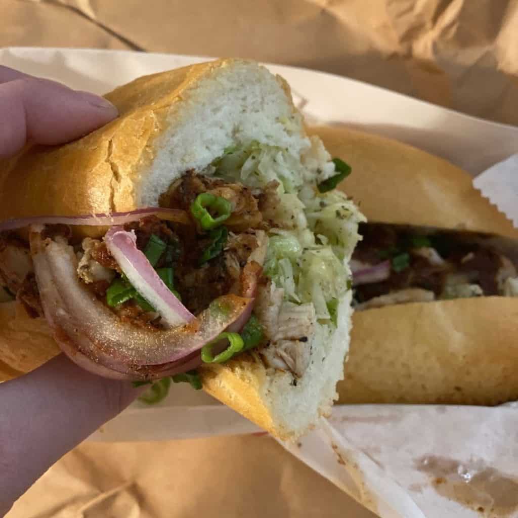 Closeup of the BBQ chicken confit po boy from Killer Po Boys.