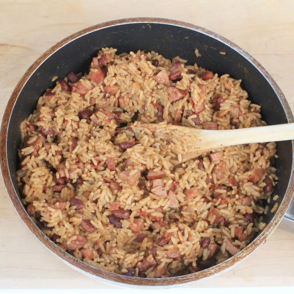 Photo of a large pot of red beans and rice mixed together.