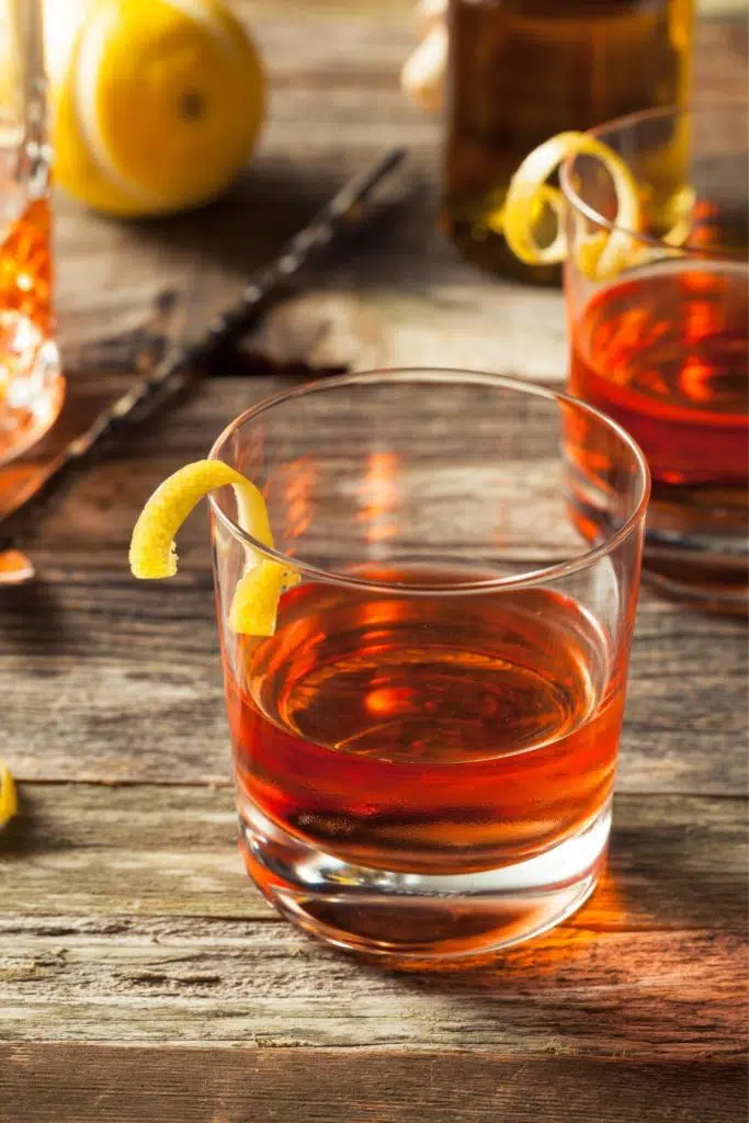 Closeup of a sazerac cocktail in a short glass.