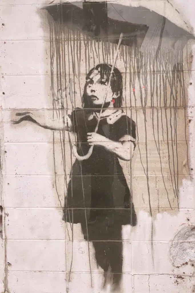 Closeup of artwork by Banksy in New Orleans.