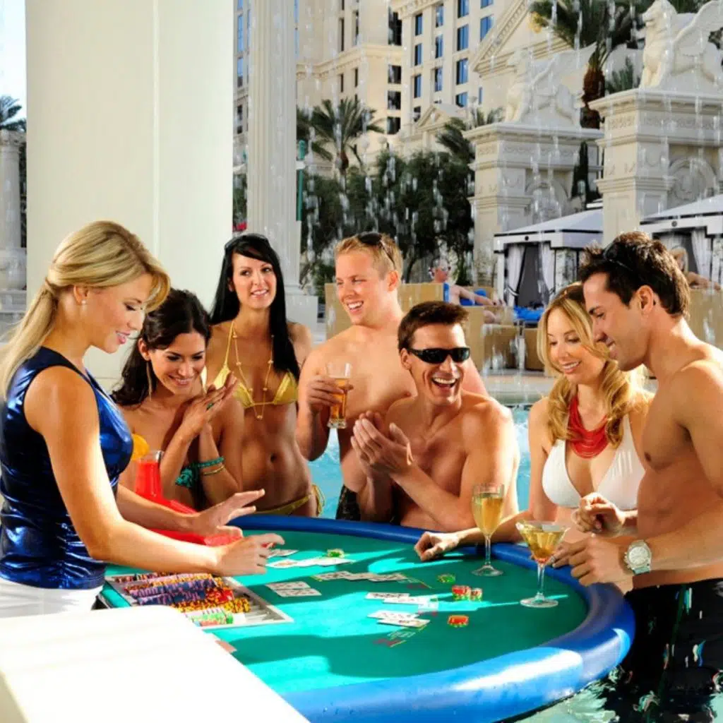 Photo of people playing Blackjack at the Fortuna Pool at Caesars Palace resort.