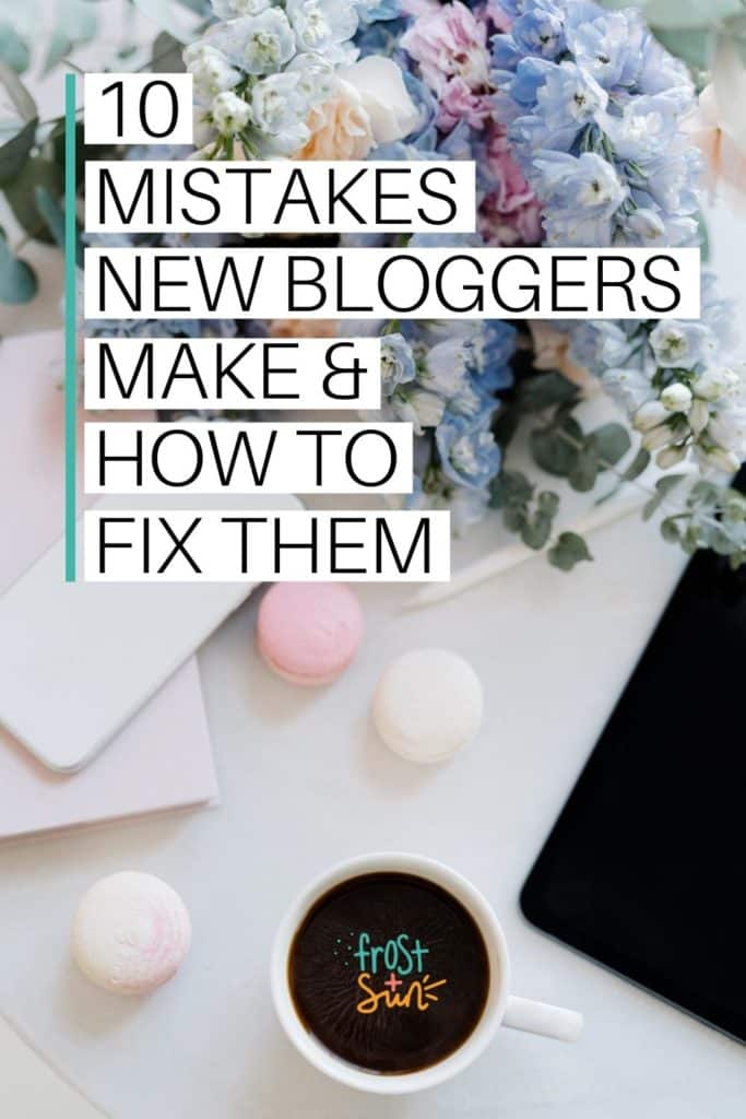 Photo of a white workspace with pastel flowers. Text overlay reads "10 Mistakes New Bloggers Make & How to Fix Them."