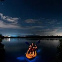 Photo of 2 people kayaking in Laguna Grande bio bay.