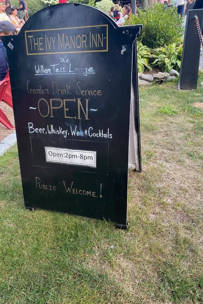 Photo of the happy hour sign outside the Ivy Manor Inn in Bar Harbor.
