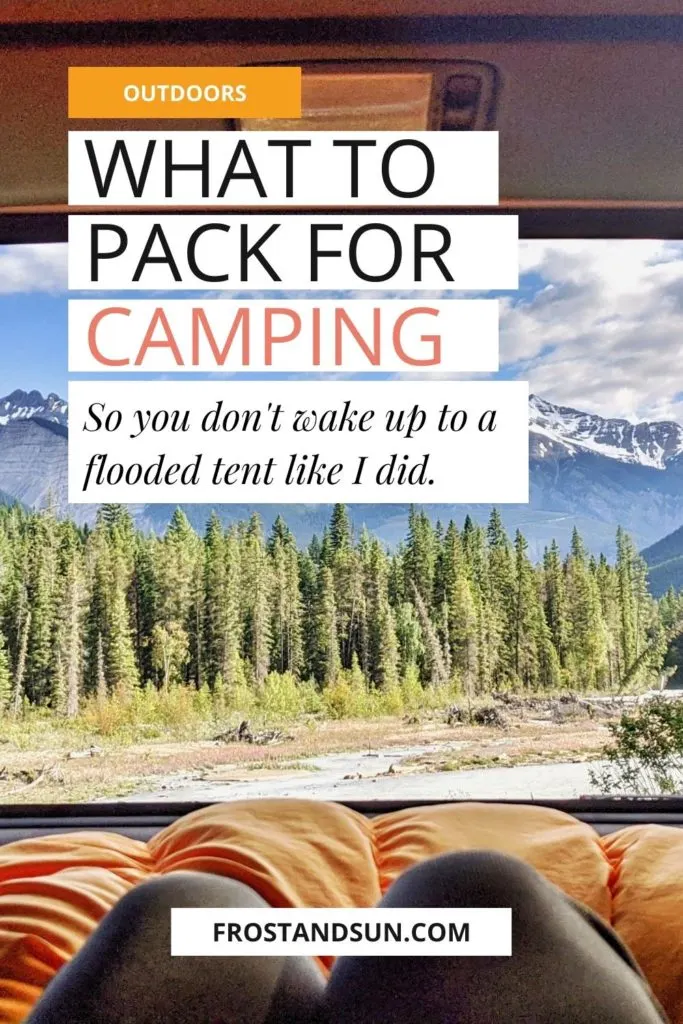 Photo from inside the back of a car with a sleeping bag in the middle ground and mountains and trees in the background. Text overlay reads "What to Pack for Camping So You Don't Wake Up to a Flooded Tent Like I Did."