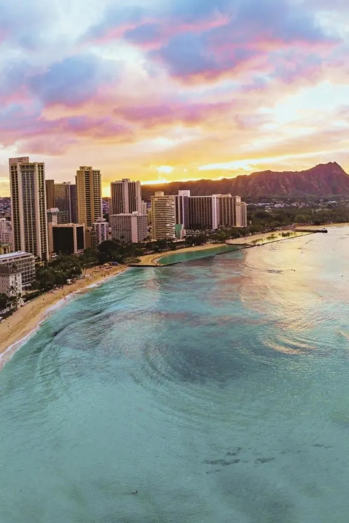 Aerial photo of Waikiki and Diamond Head during sunset.