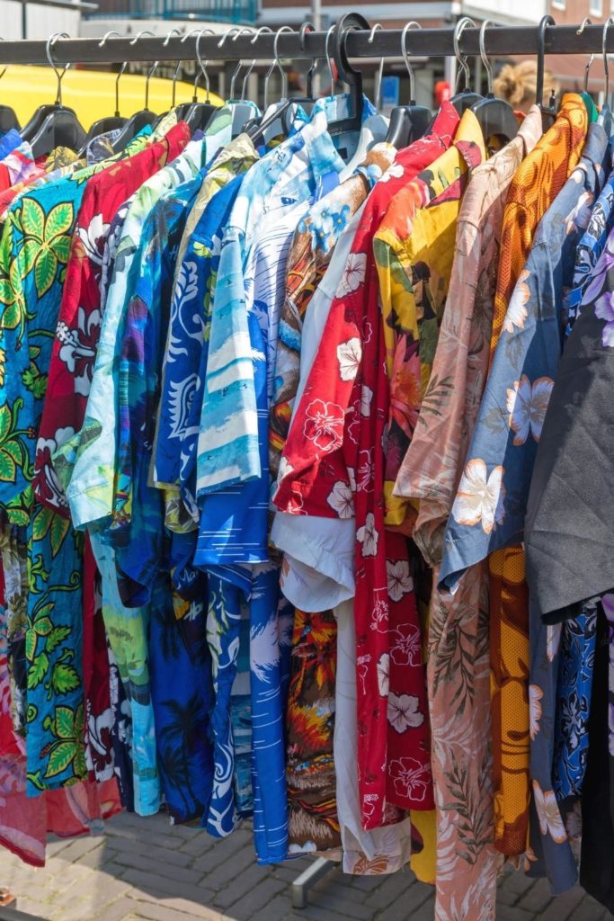 Closeup of a clothing rack filled with Aloha Shirts