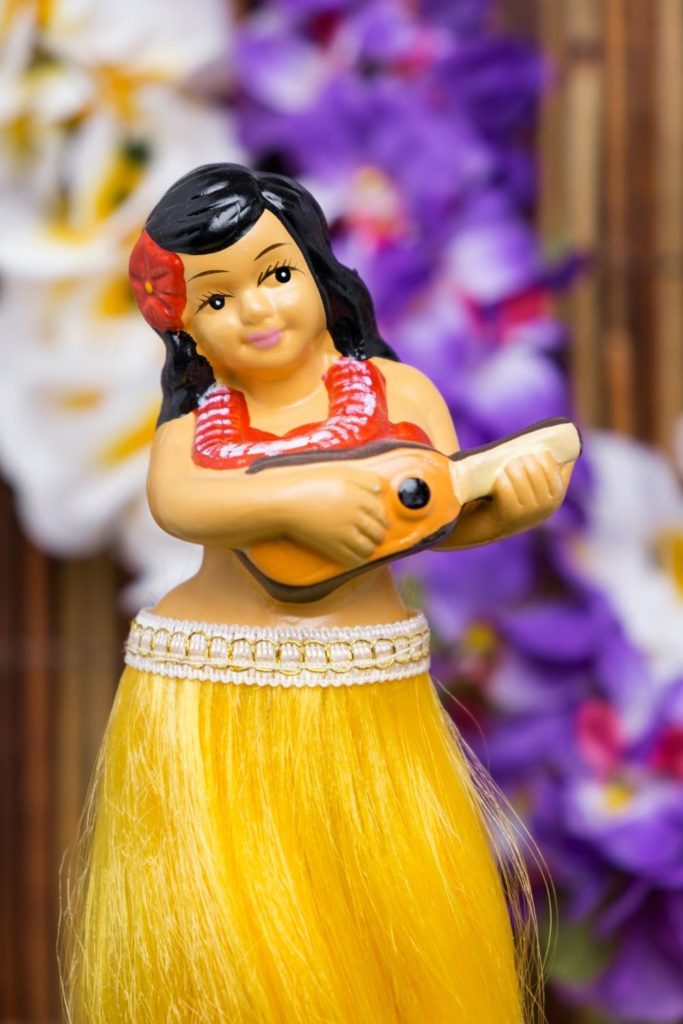 Closeup of a photo of a hula girl doll