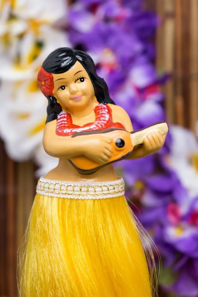 Closeup of a photo of a hula girl doll