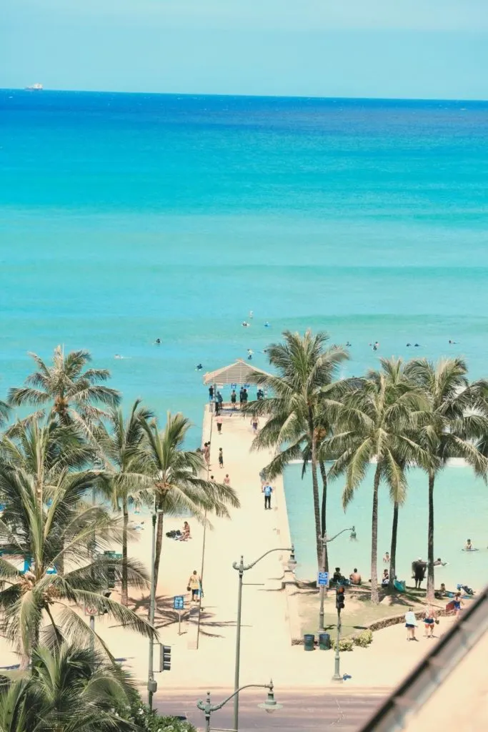 Photo of the Waikiki Wall near the Waikiki Marine Life Conservation Area with people snorkeling nearby.