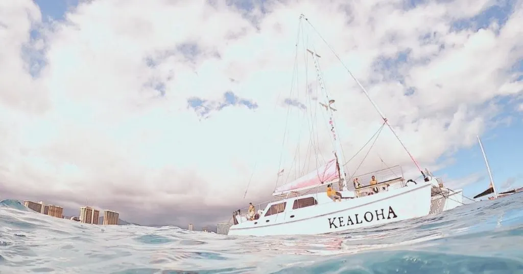 Photo of Pink Sails' Kealoha catamaran anchored near Turtle Canyon off the coast of Oahu.