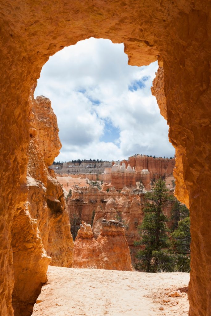 Photo through a stone arch at Bryce Canyon.