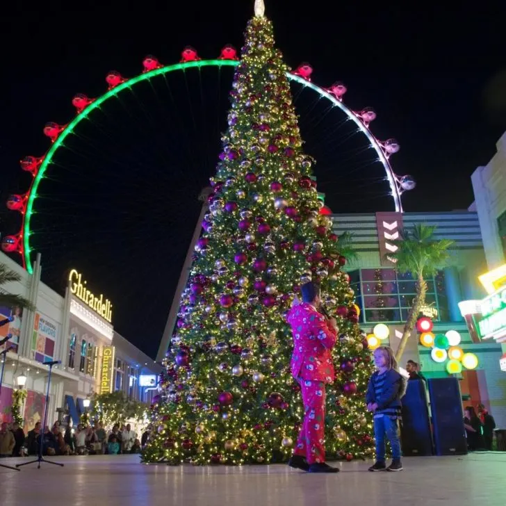 Photo of Christmas decor at the LINQ Promenade at night.