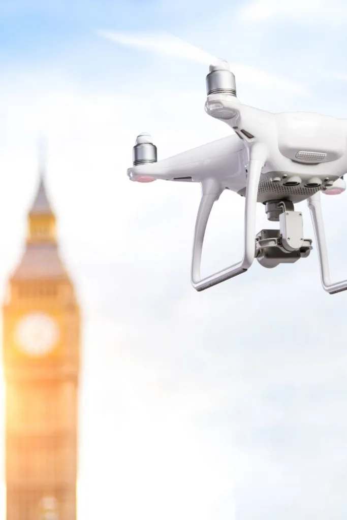 Photo of a drone hovering with London's Big Ben clock tower in the background.