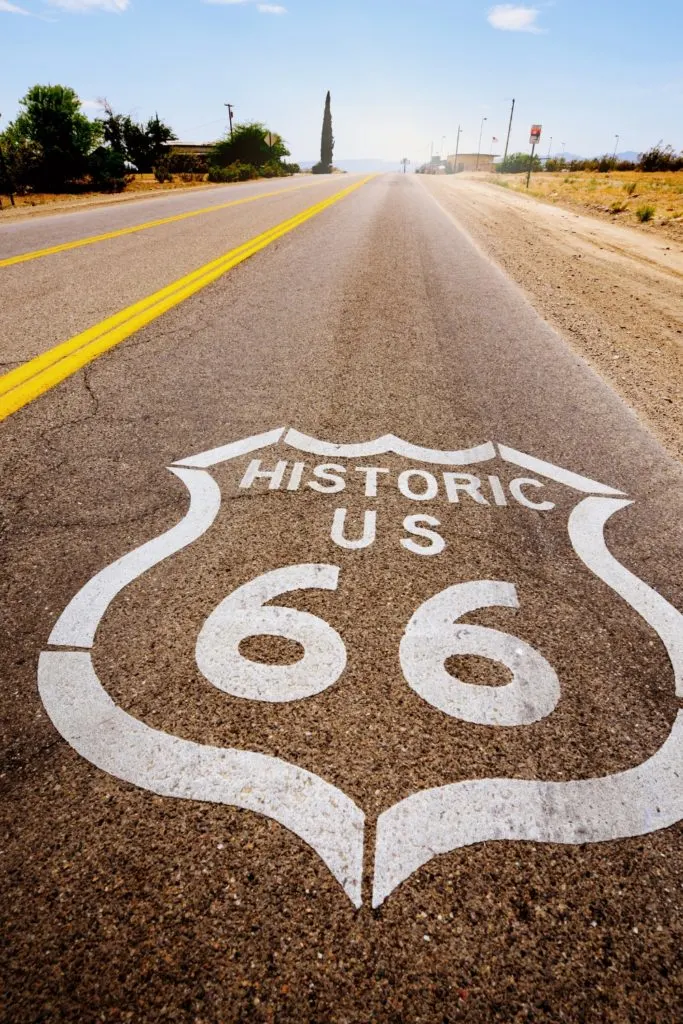 Photo of a road with "Historic US 66" route sign on it.