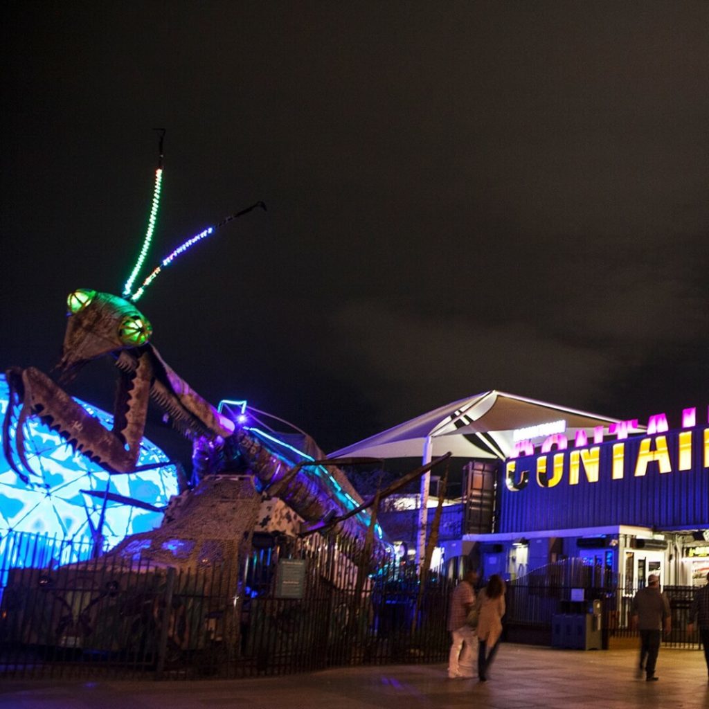 Photo of a giant praying mantis sculpture at the entrance of the Las Vegas Downtown Container Park.