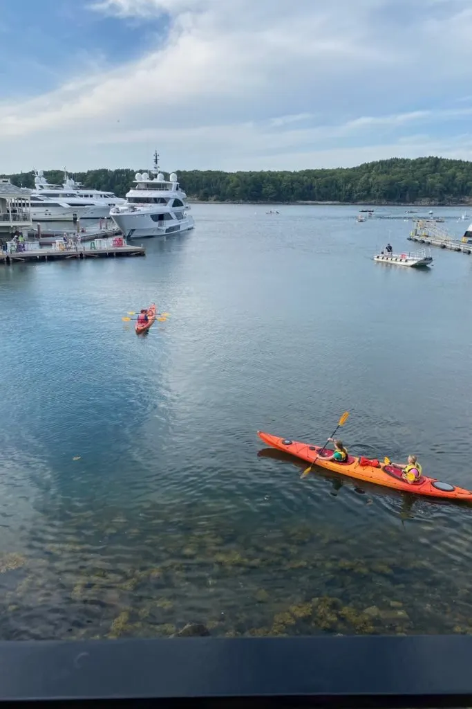 Photo of people tandem kayaking in Frenchman Bay of the Atlantic Ocean.