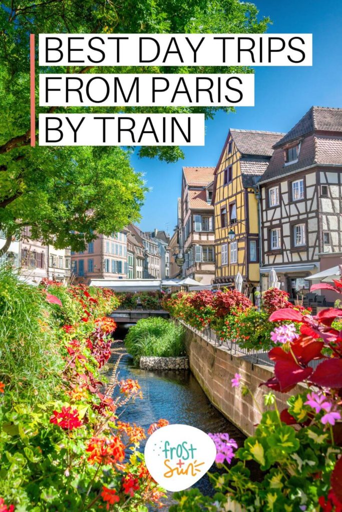 Photo of the colorful village of Colmar in France with lush trees and flowers lining a canal. Text above the photo reads "Best Day Trips from Paris by Train."