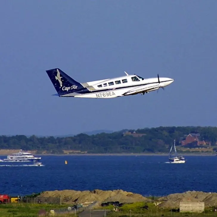 Photo of a Cape Air seaplane taking off into the air.