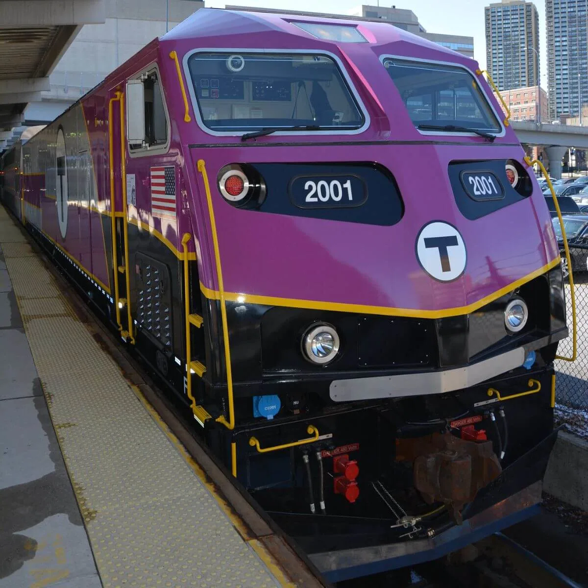 Photo of a shiny new MBTA commuter rail train, the same organization that provides the CapeFLYER train service.