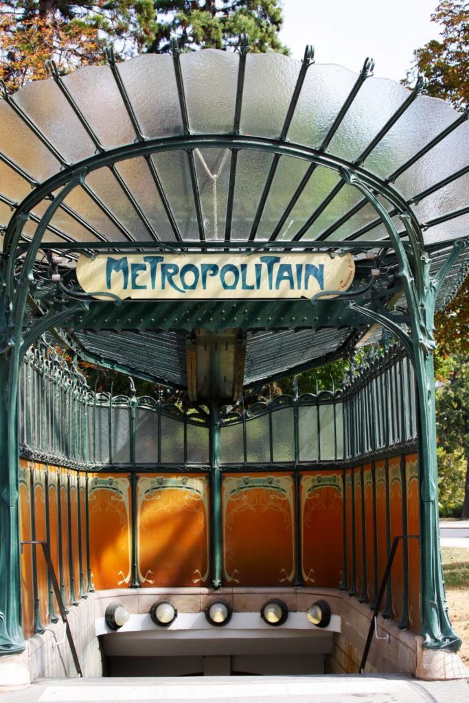 Photo of an art nouveau style metro station entrance in Paris, France.