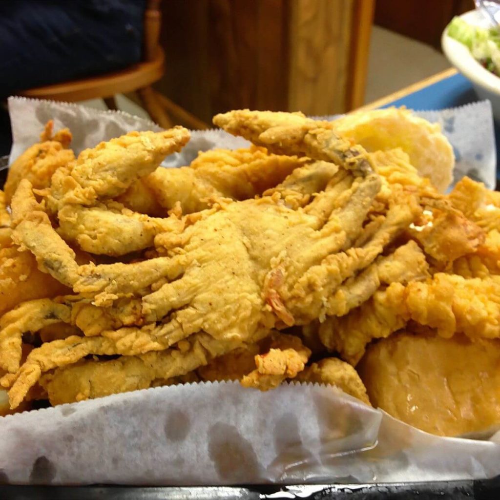 Close up photo of fried whole soft shell crab.