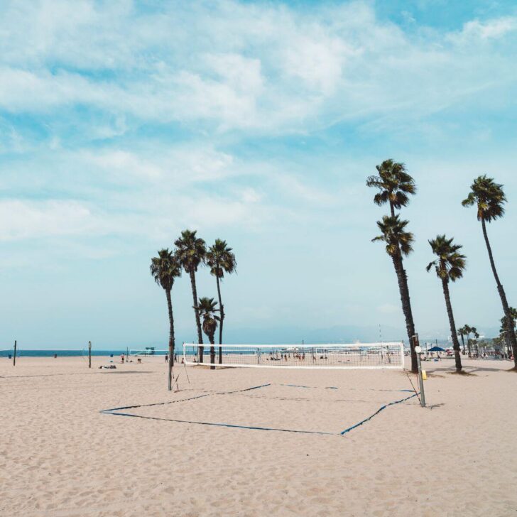 Photo of a beach volleyball net setup at Venice Beach in California.