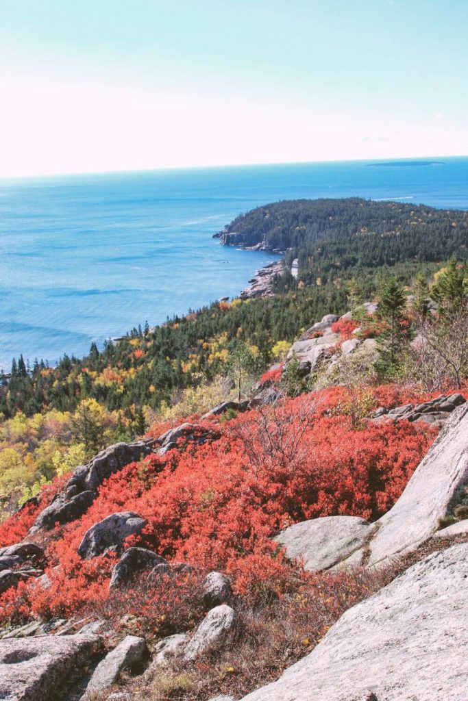 Photo of the view from the summit of Goreham Mountain with Fall foliage in the background.