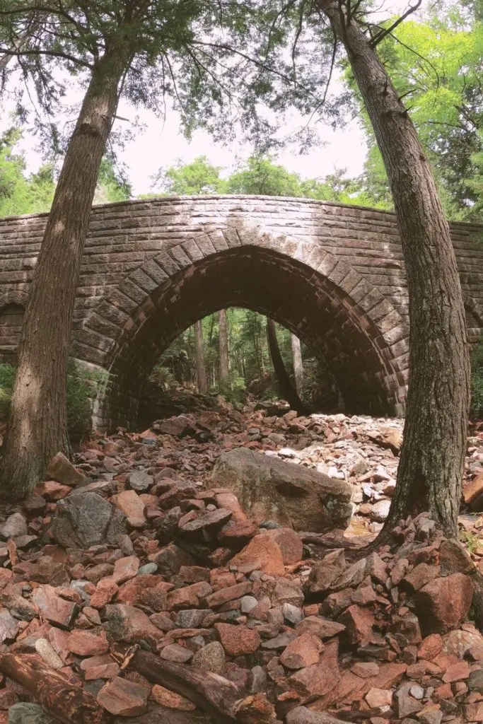 Photo of a carriage road stone bridge on the Hadlock Loop Trail in Acadia National Park.