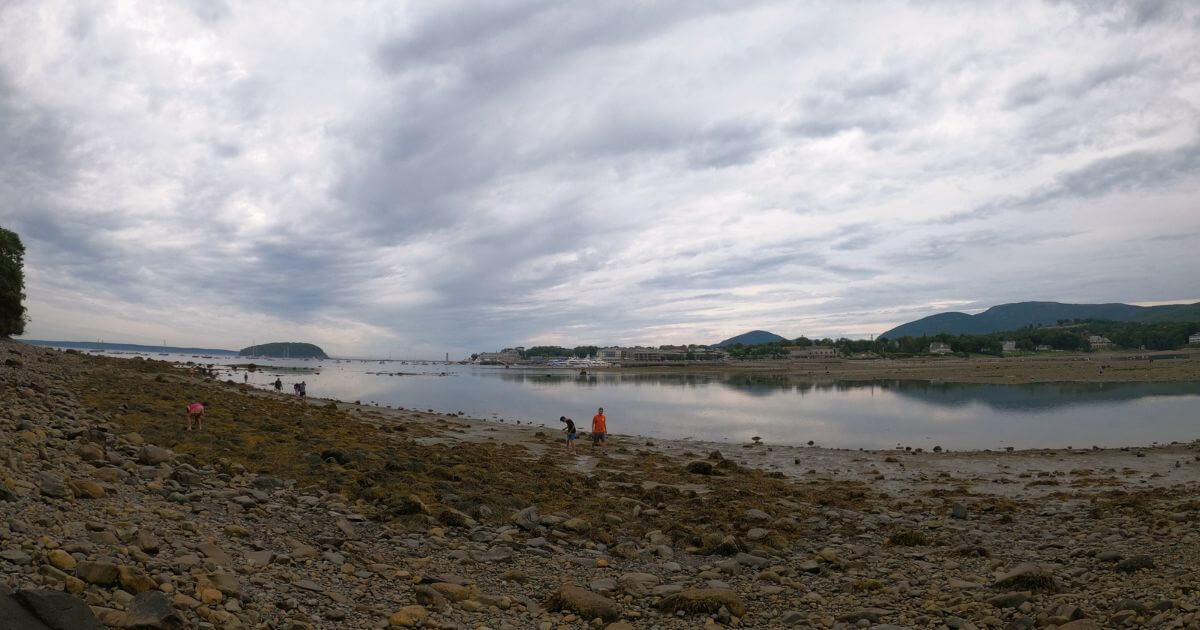 Photo from the shore of Bar Island looking across Frenchman Bay to downtown Bar Harbor and the shoreline along Mount Desert Island in Maine.