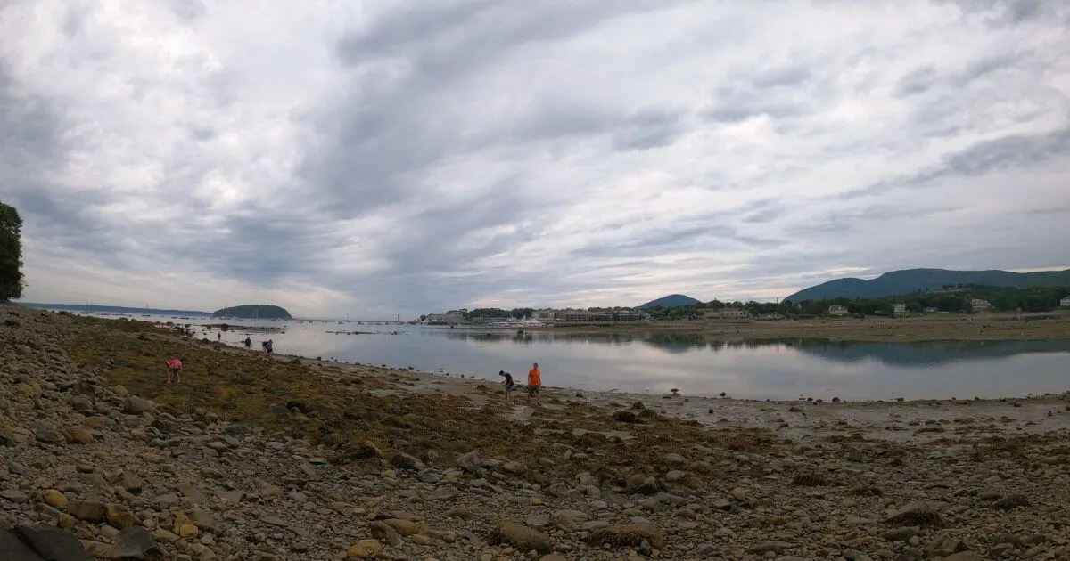 Photo from the shore of Bar Island looking across Frenchman Bay to downtown Bar Harbor and the shoreline along Mount Desert Island in Maine.