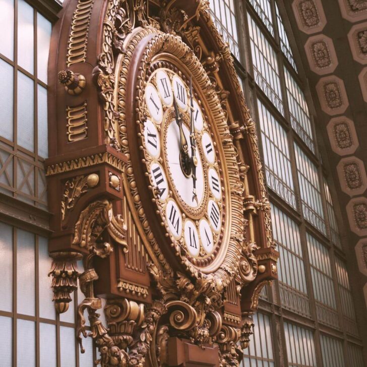 Photo of the elaborate clock at Musee D'Orsay, set in a former train station in Paris.