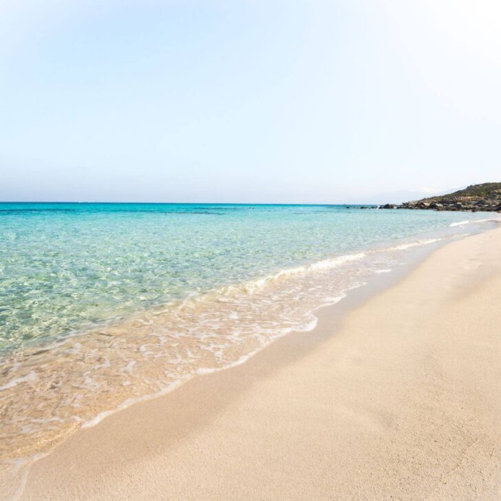 Photo of the crystal clear aqua waters at Plage de Saleccia in Corsica.