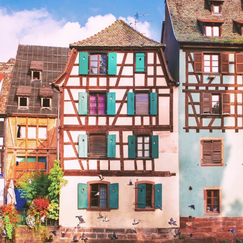 Photos of colorful half-timbered homes in Strasbourg, France on the border of Germany.